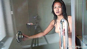 Adorable asian teenie Kat with perky tits taking a shower