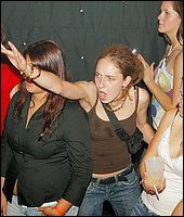Muscular strippers seducing drunken chicks in the night club
