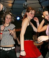 Muscular strippers seducing drunken chicks in the night club