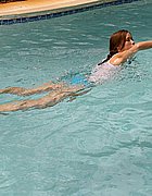 Next door Brooky swimming in the pool